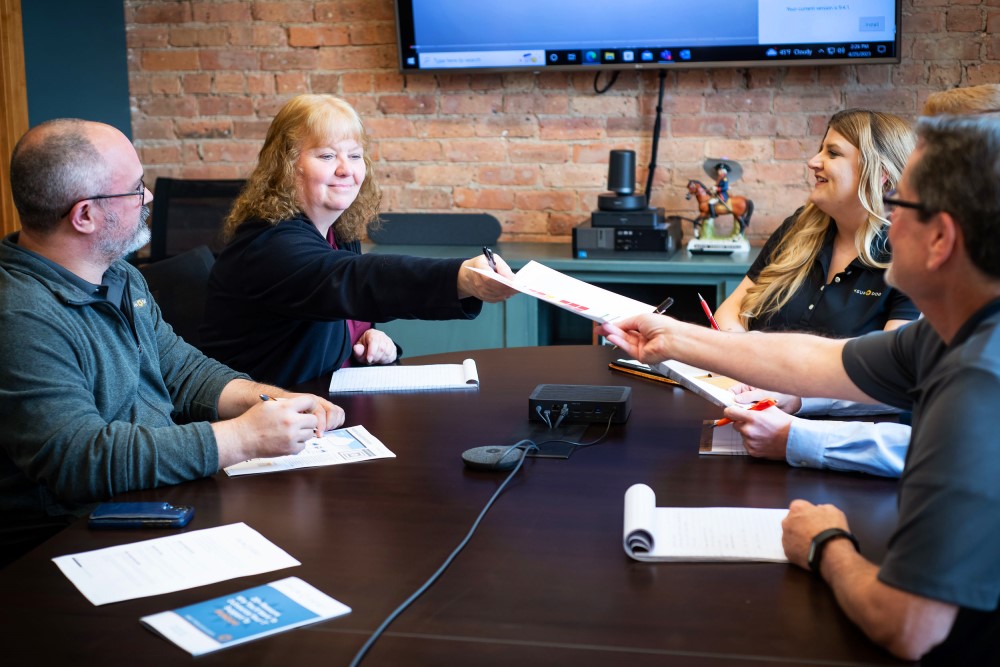 Steph handing over papers